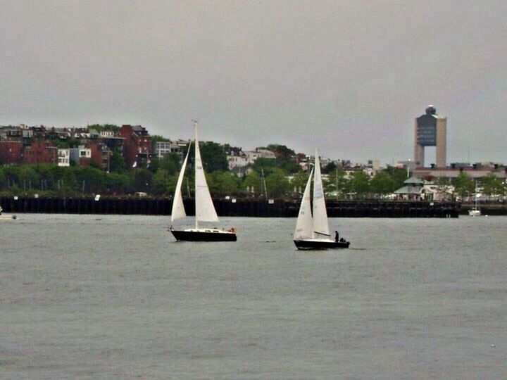 BOATS SAILING IN SEA