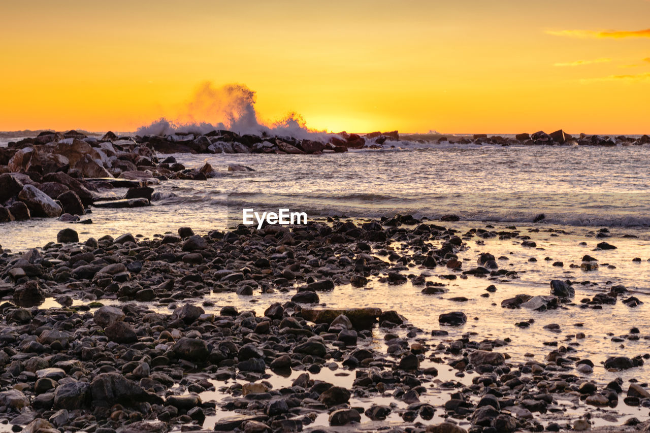 Scenic view of sea against sky during sunset