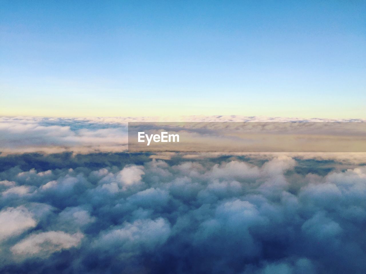 AERIAL VIEW OF CLOUDSCAPE OVER LANDSCAPE