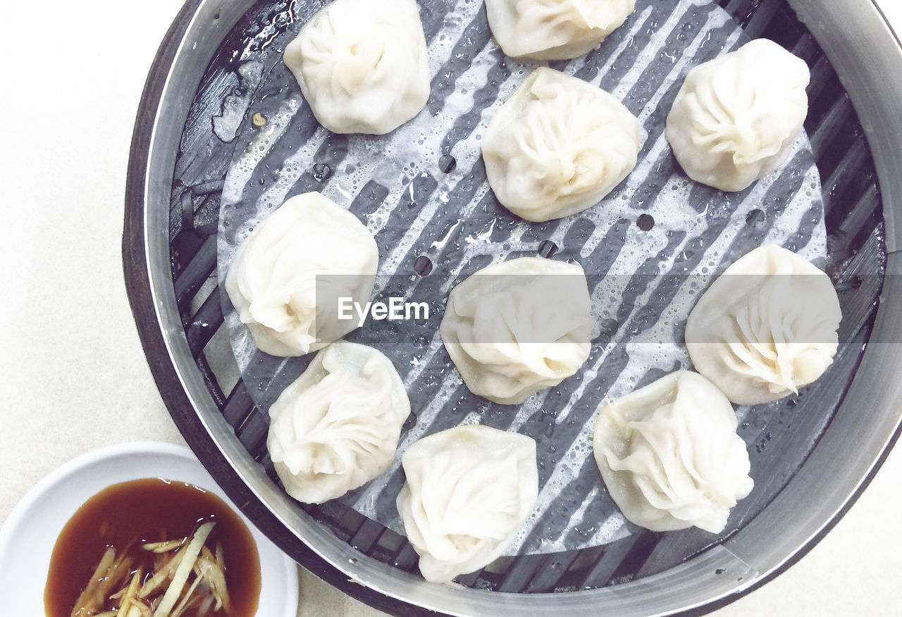 High angle view of dim sum in bento box on table