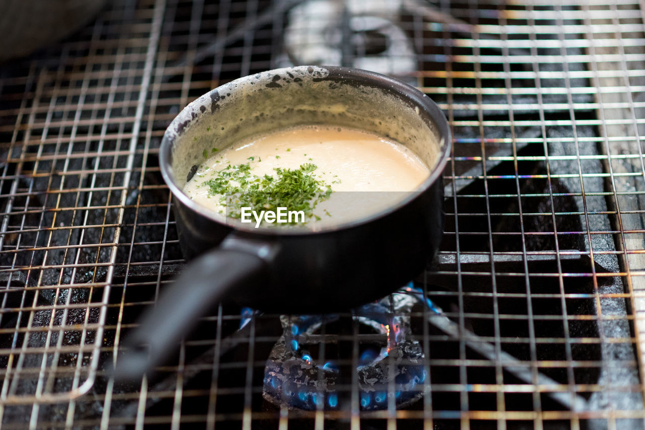 HIGH ANGLE VIEW OF FOOD ON TABLE AT KITCHEN