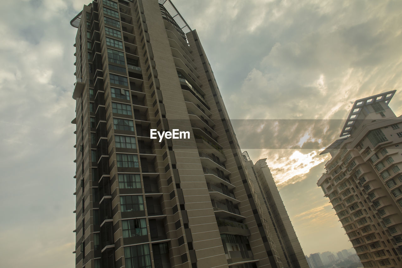 Low angle view of modern buildings against sky