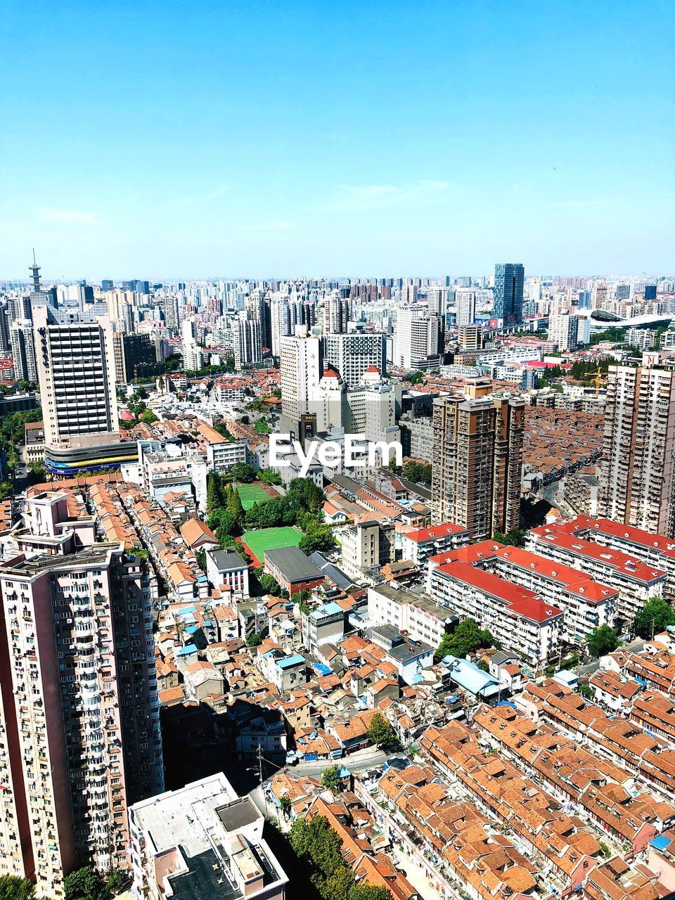 High angle view of city buildings against clear sky