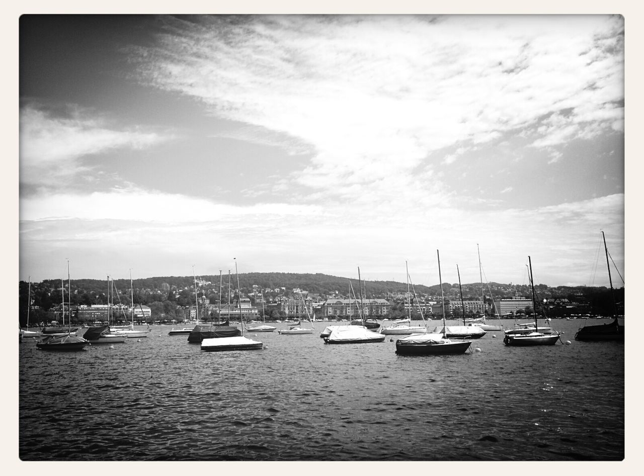 BOATS MOORED IN HARBOR