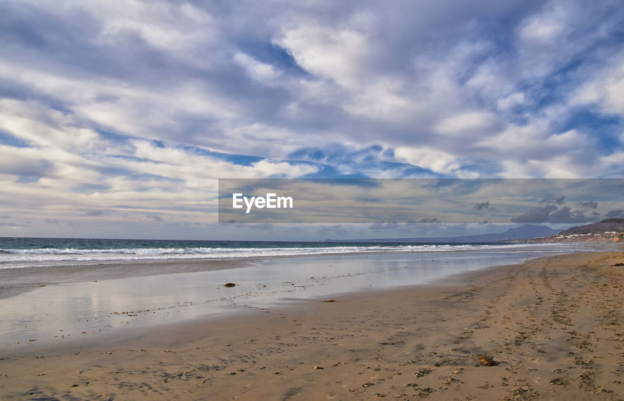 VIEW OF BEACH AGAINST SKY