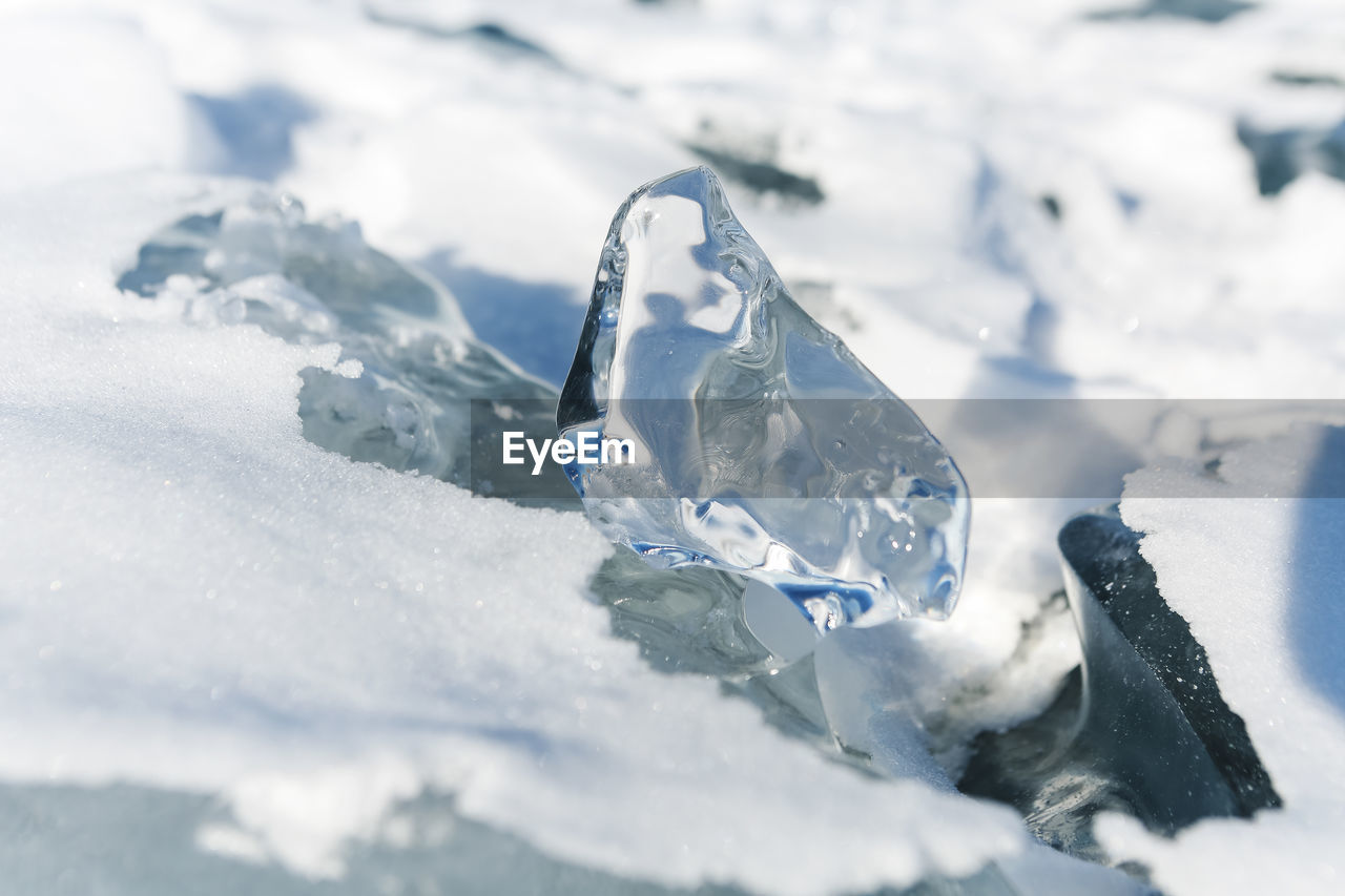 close-up of water splashing on snow covered field