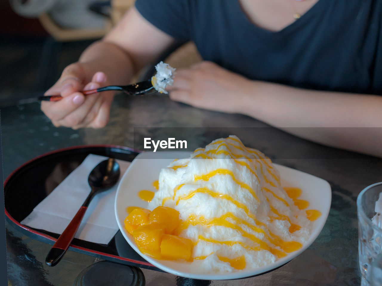 Midsection of woman preparing food on table