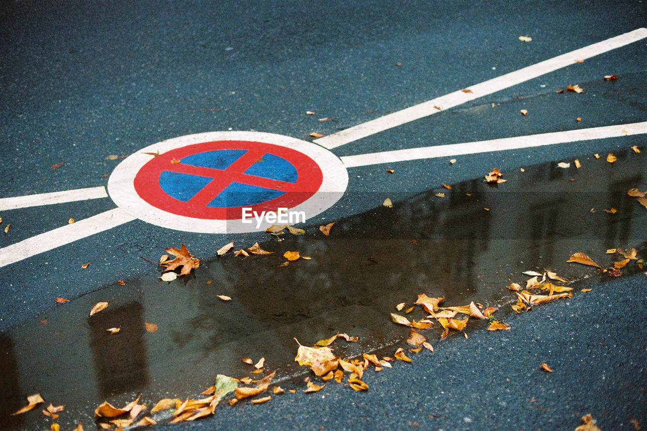 High angle view of road sign on street