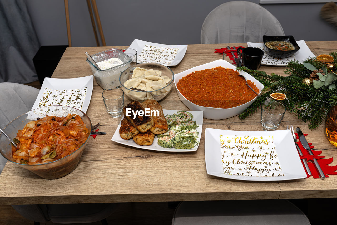 food and drink, food, table, high angle view, meal, supper, indoors, no people, plate, freshness, dish, healthy eating, cuisine, wellbeing, still life, brunch, lunch, vegetable, dinner, variation, bowl, buffet, meat, drink