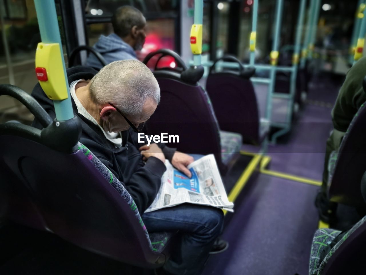 MEN SITTING IN BUS