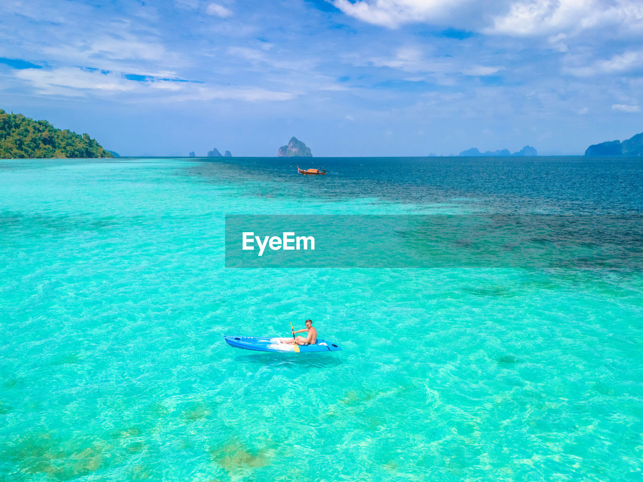 high angle view of woman swimming in sea against sky