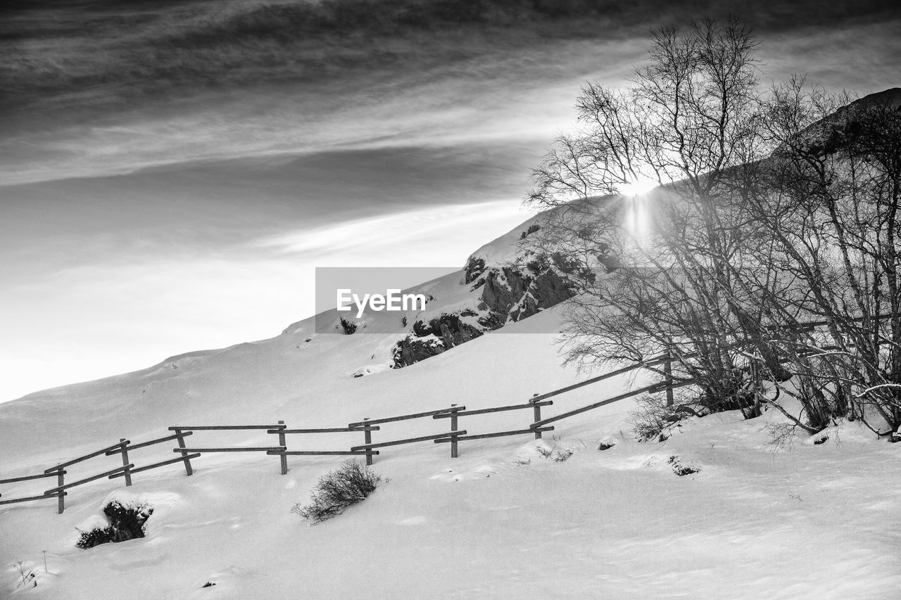 Scenic view of snow covered landscape against sky