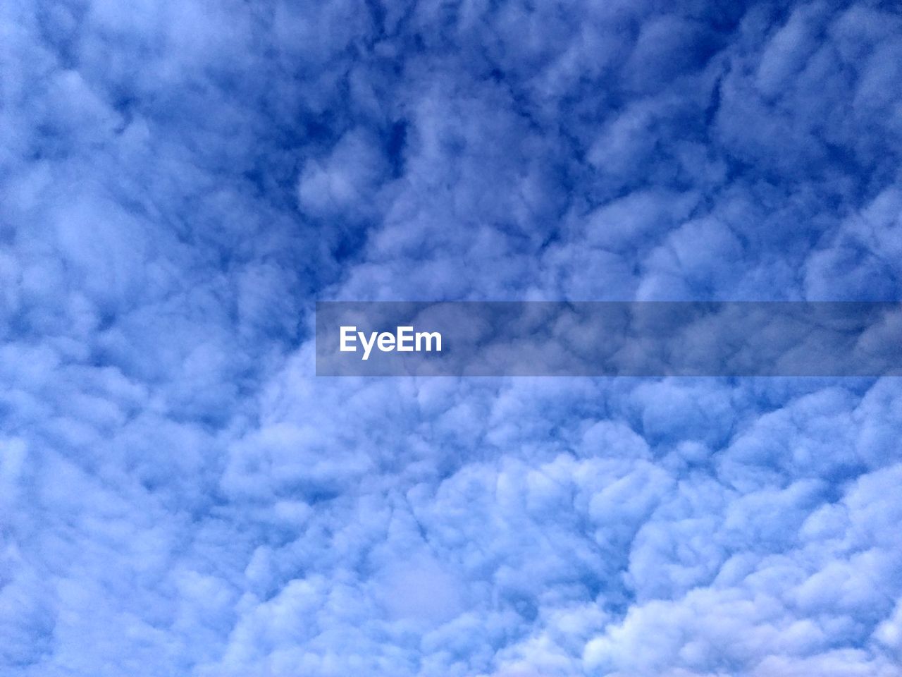 ABSTRACT IMAGE OF BLUE SKY AND CLOUDS