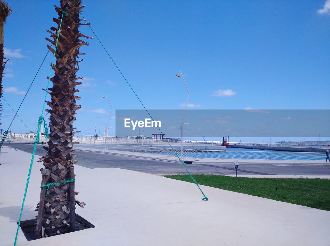 Scenic view of beach against blue sky