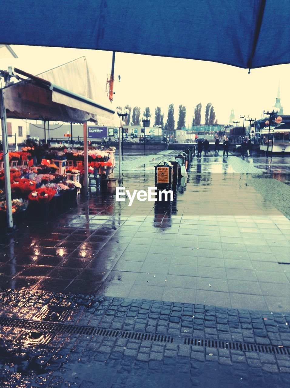 Footpath by market on rainy day