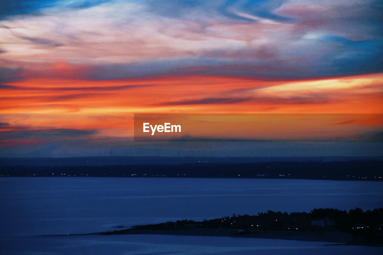 SCENIC VIEW OF DRAMATIC SKY AT SUNSET