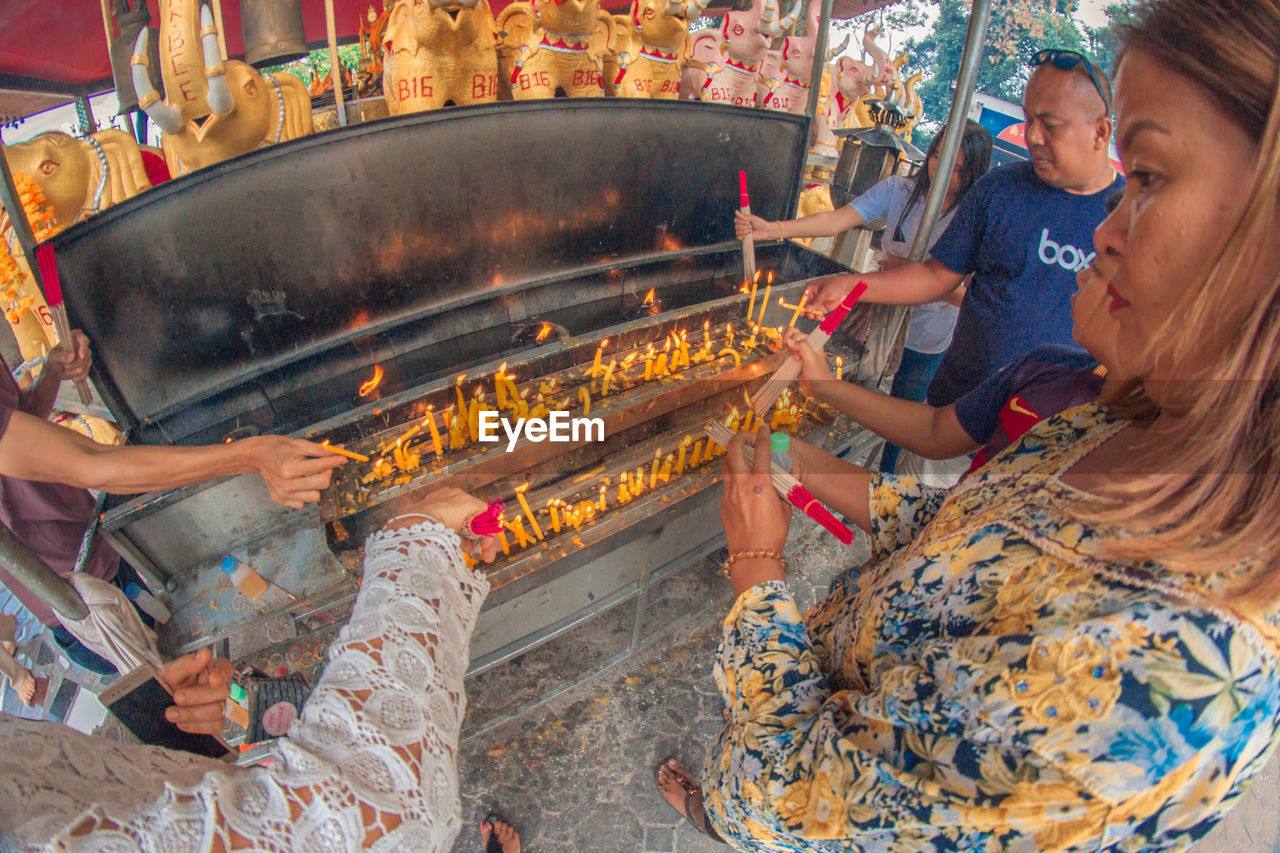 PEOPLE SITTING IN A FOOD