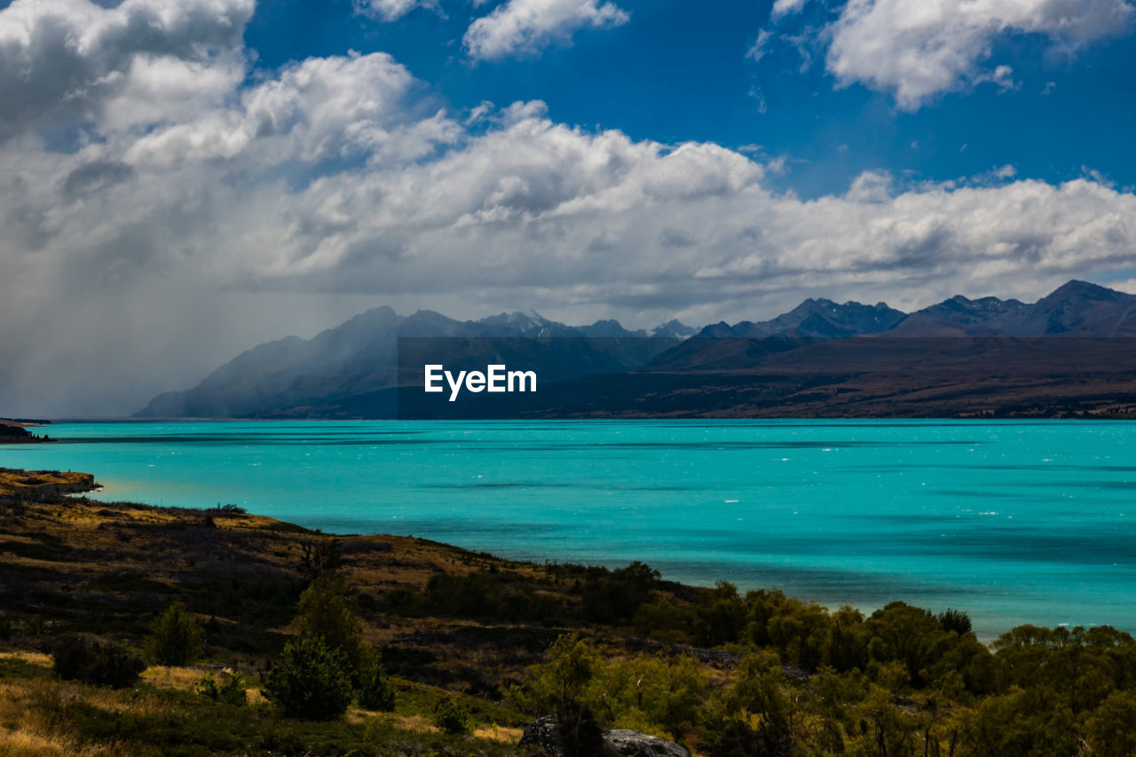 Scenic view of sea against cloudy sky