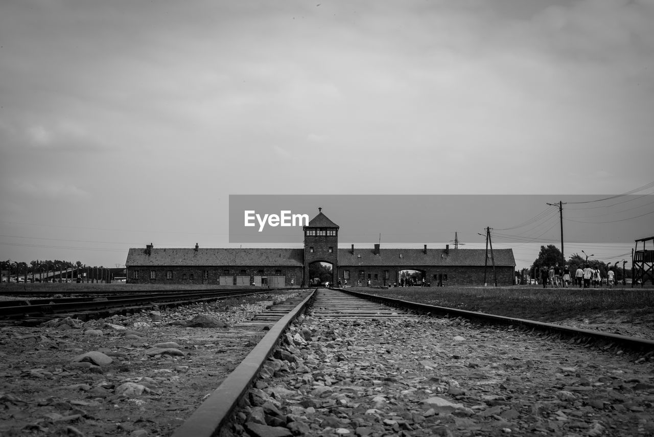 Train on railroad tracks against sky