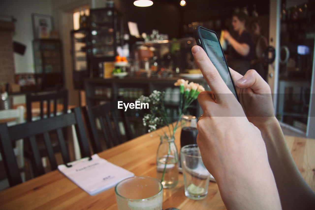 Close-up of hands using smart phone