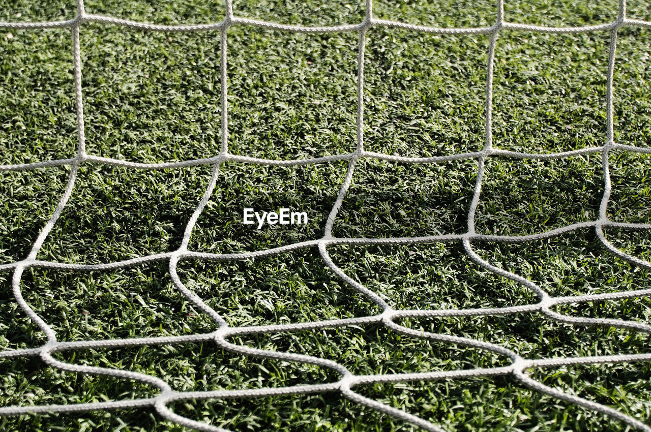 Close-up of net on grassy field