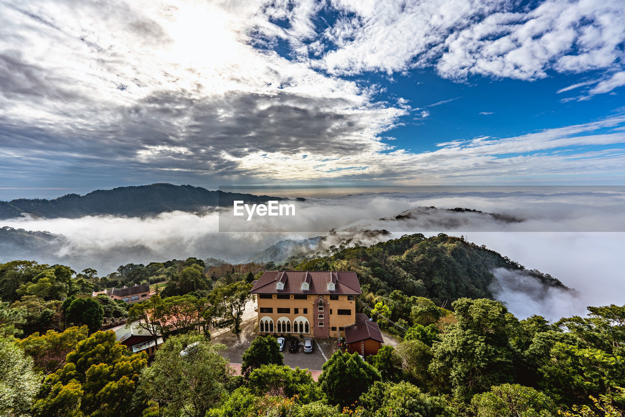 high angle view of townscape against cloudy sky