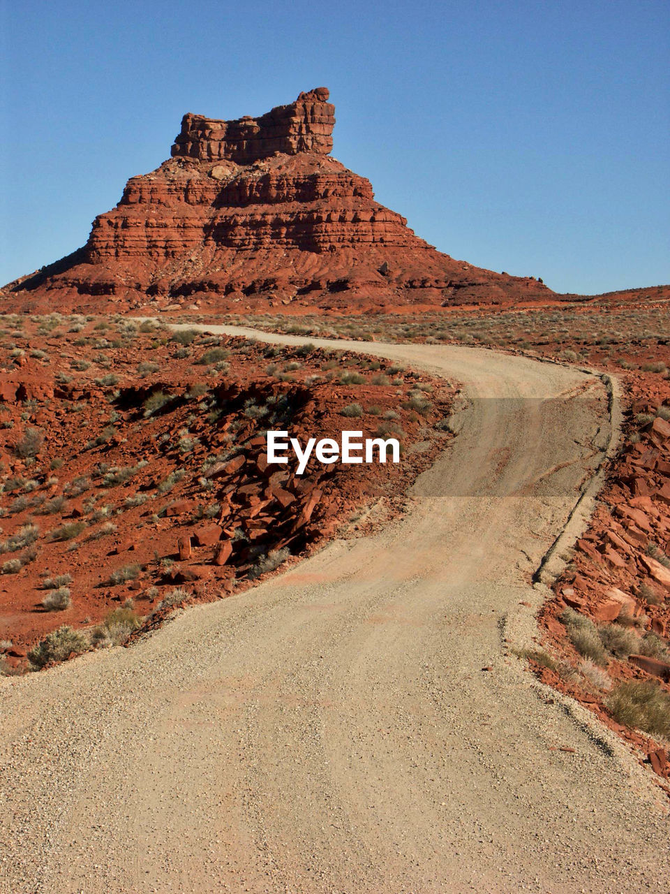 Dirt road against valley of the gods