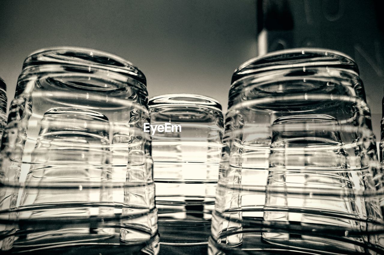 Close-up of upside down glasses on table