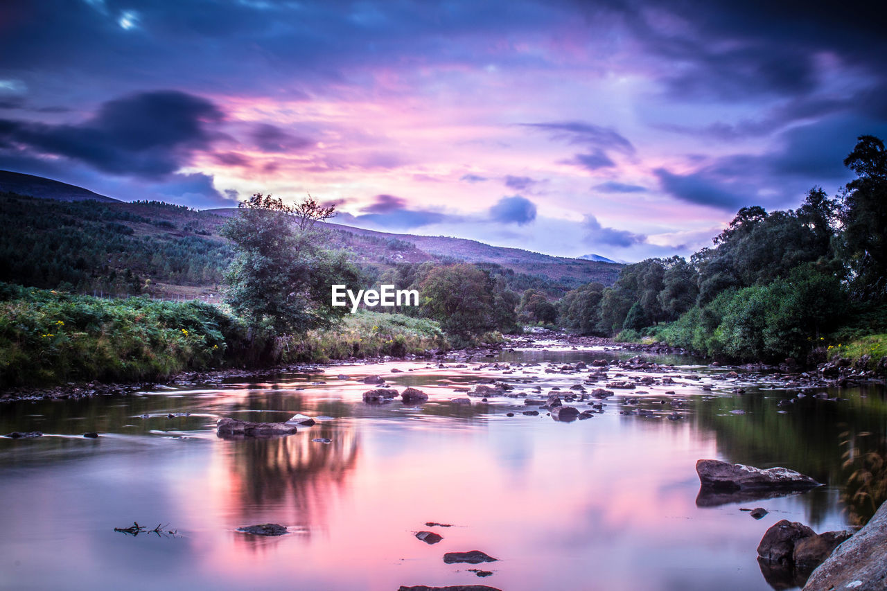 SCENIC VIEW OF LAKE AND MOUNTAINS