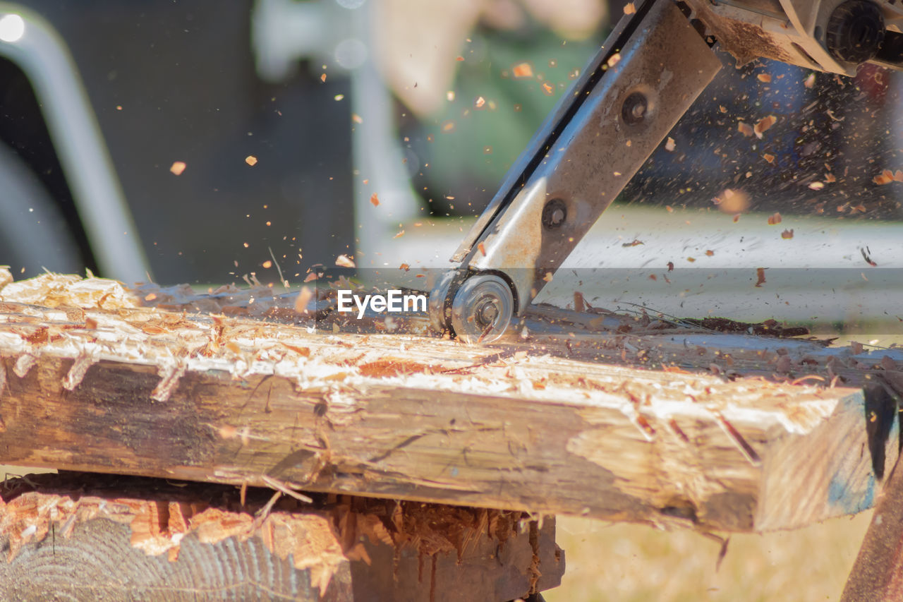 Close-up of equipment on wooden sculpture