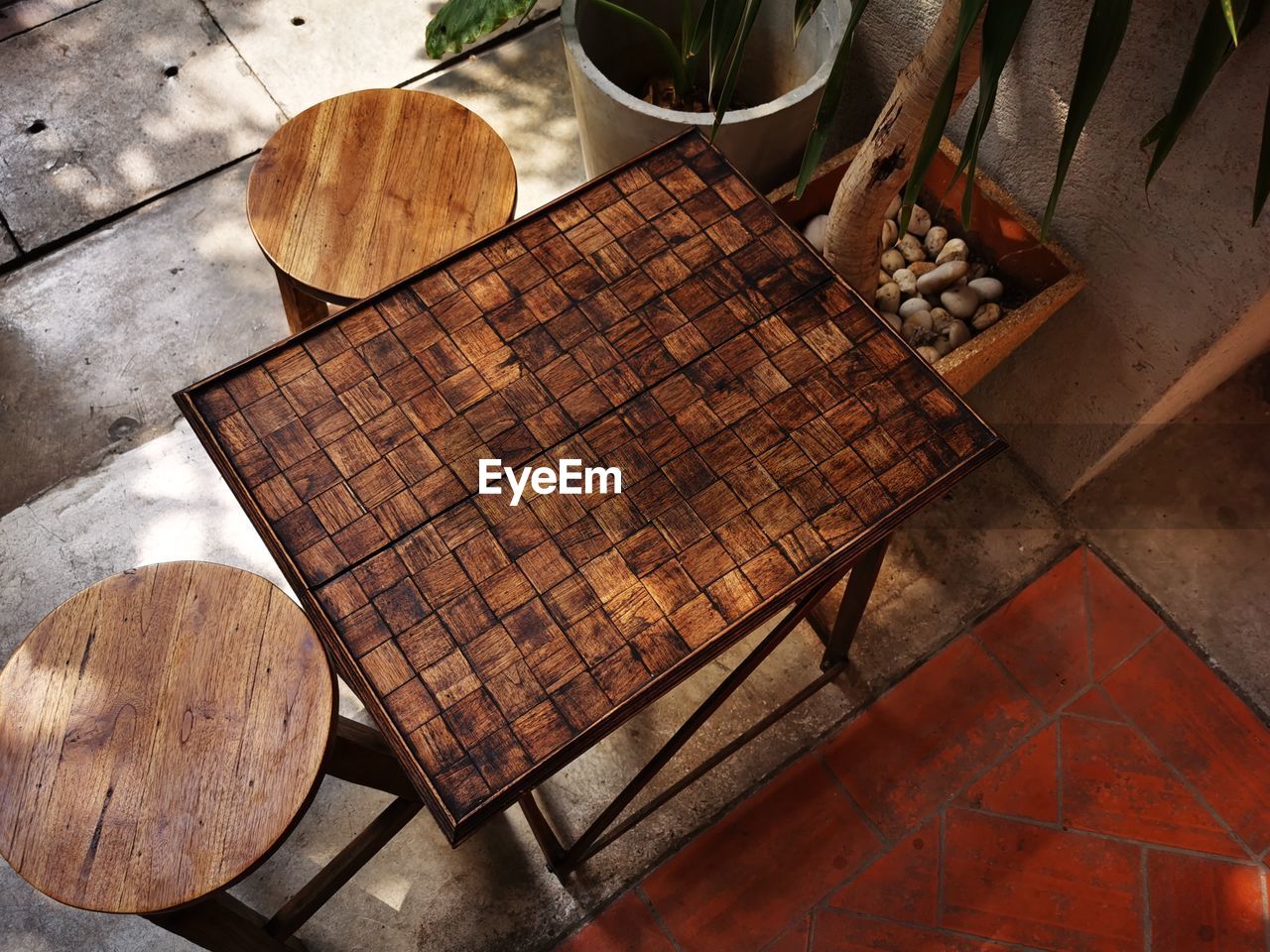 High angle view of empty table and seats at outdoor cafe