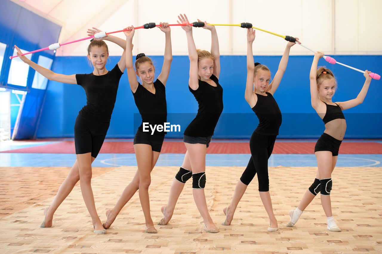 Portrait of ballet dancers dancing at ballet studio