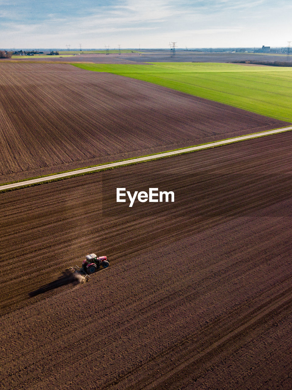 Aerial view of combine harvester on agricultural field
