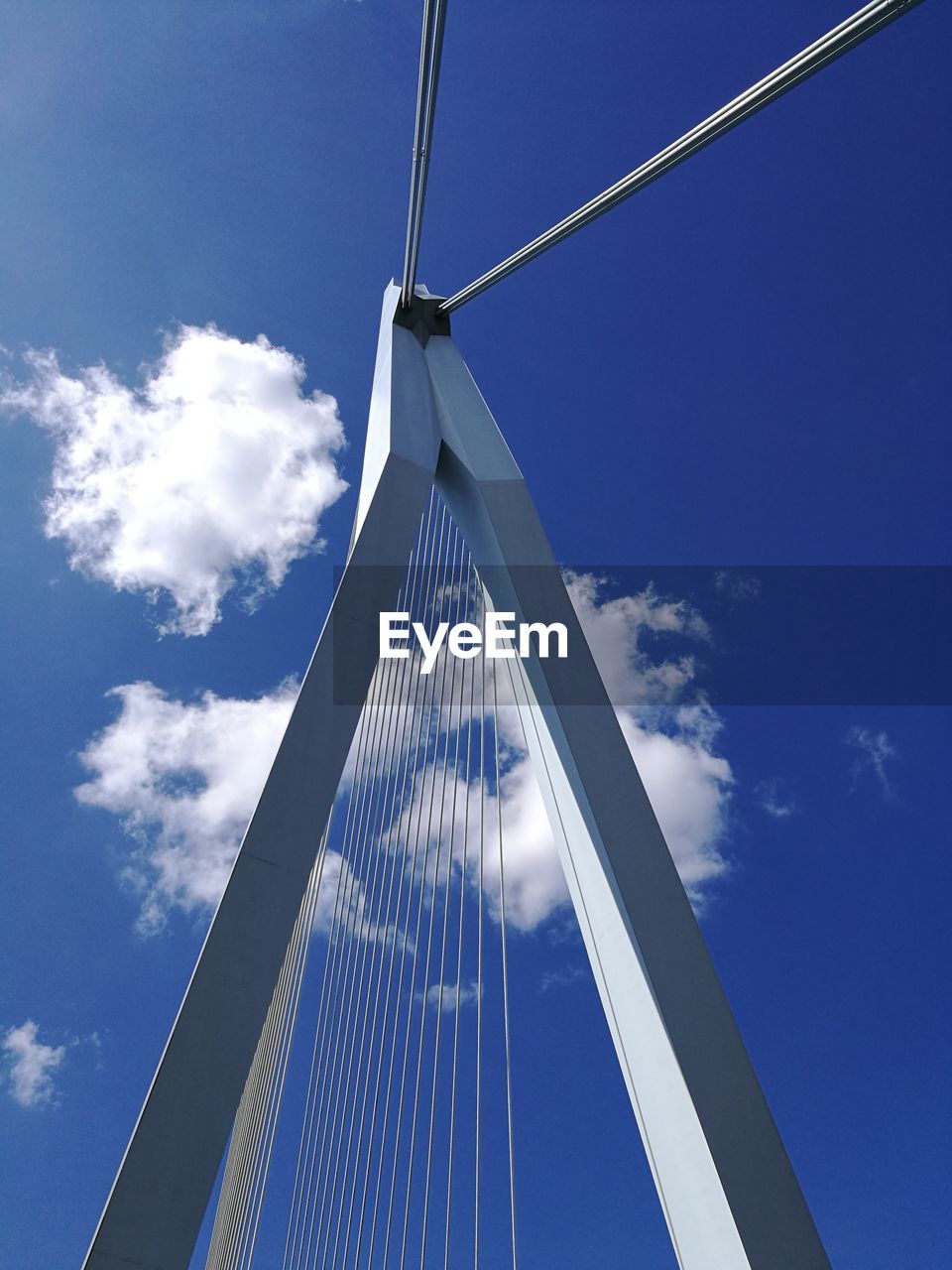 LOW ANGLE VIEW OF METALLIC BRIDGE AGAINST SKY