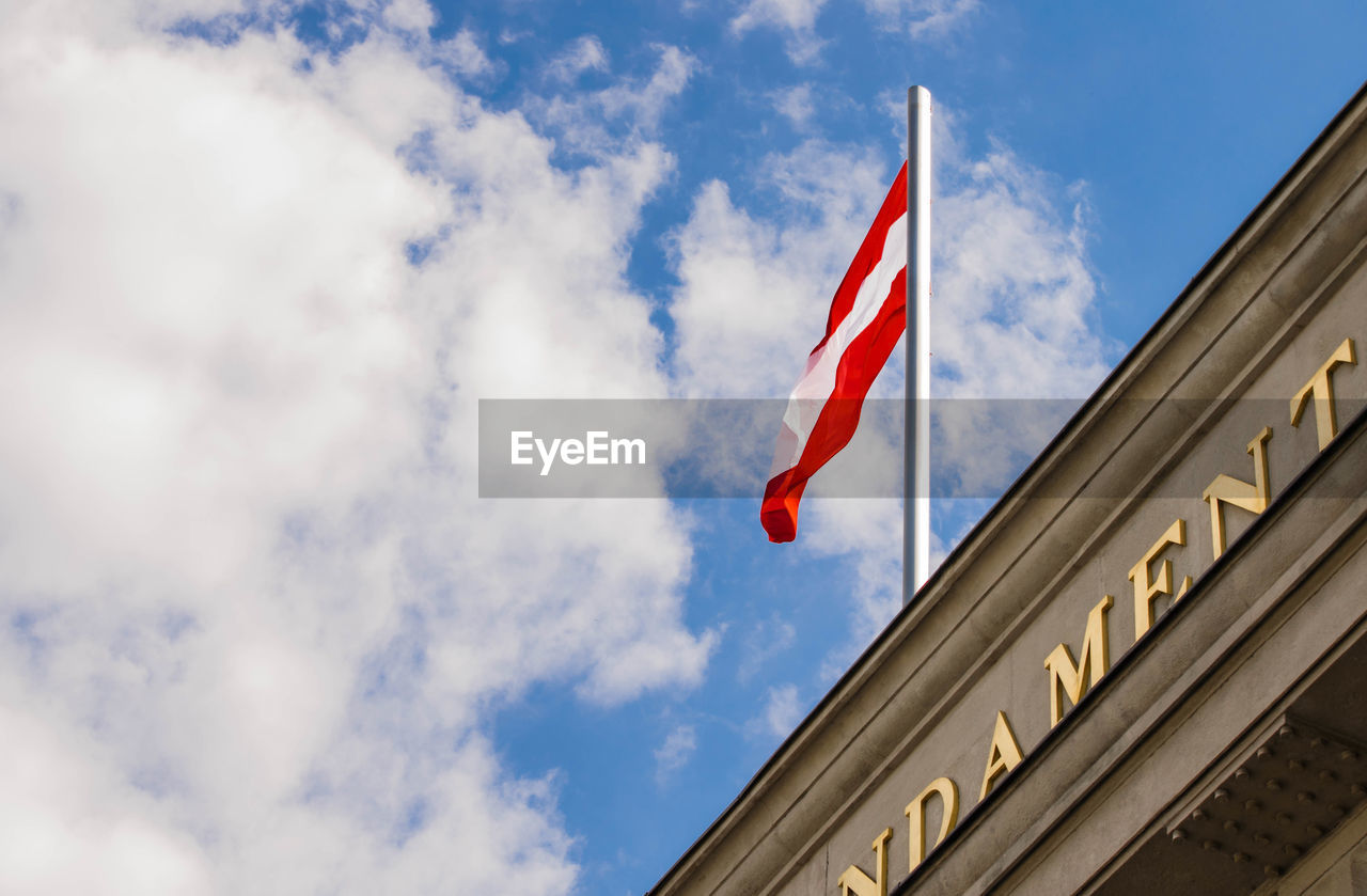 LOW ANGLE VIEW OF FLAGS FLAG AGAINST SKY