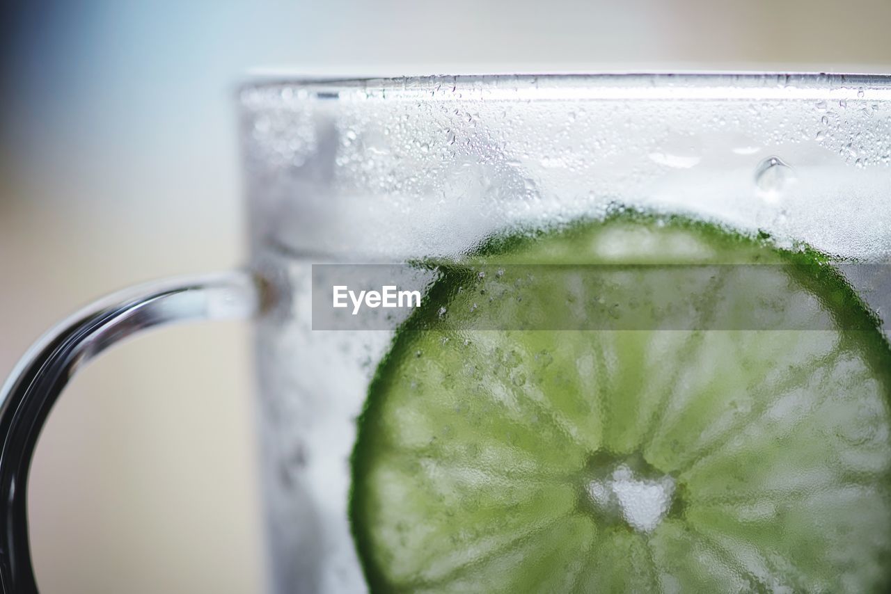 CLOSE-UP OF WET GLASS WITH WATER