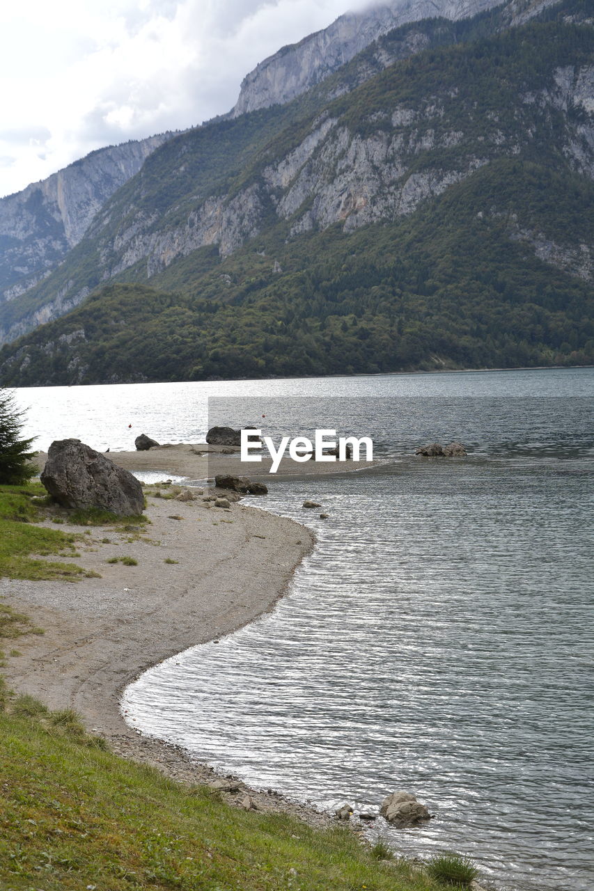 SCENIC VIEW OF MOUNTAINS AND LAKE