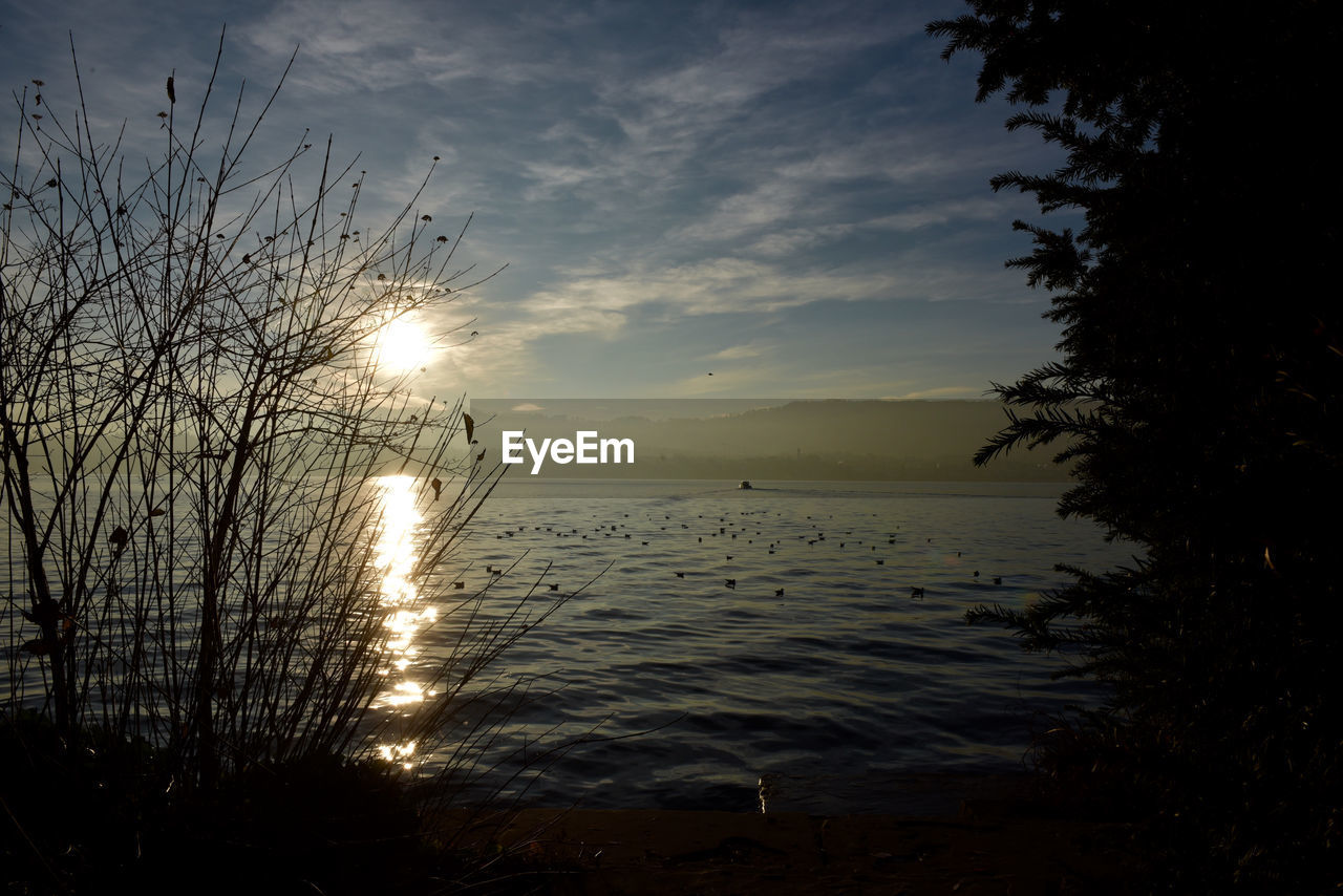 Scenic view of sea against sky at sunset