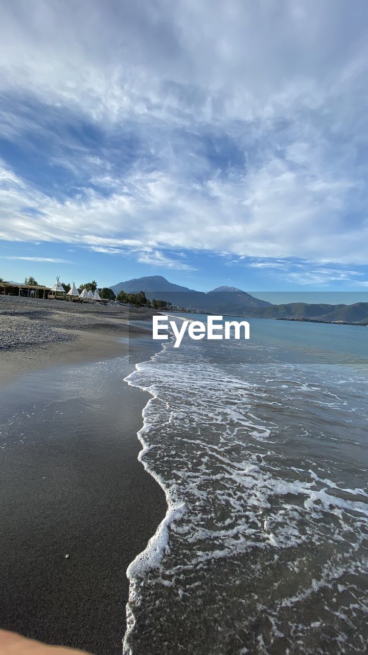 VIEW OF BEACH AGAINST SKY