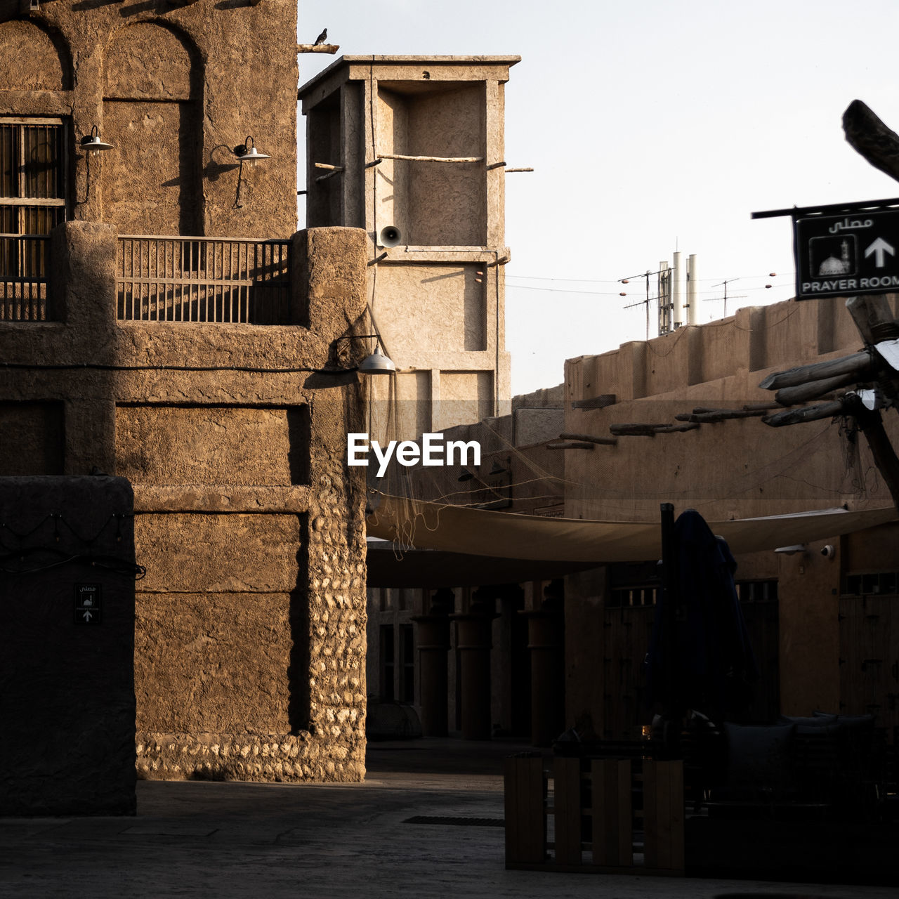 Exterior of old building in city against sky in dubai