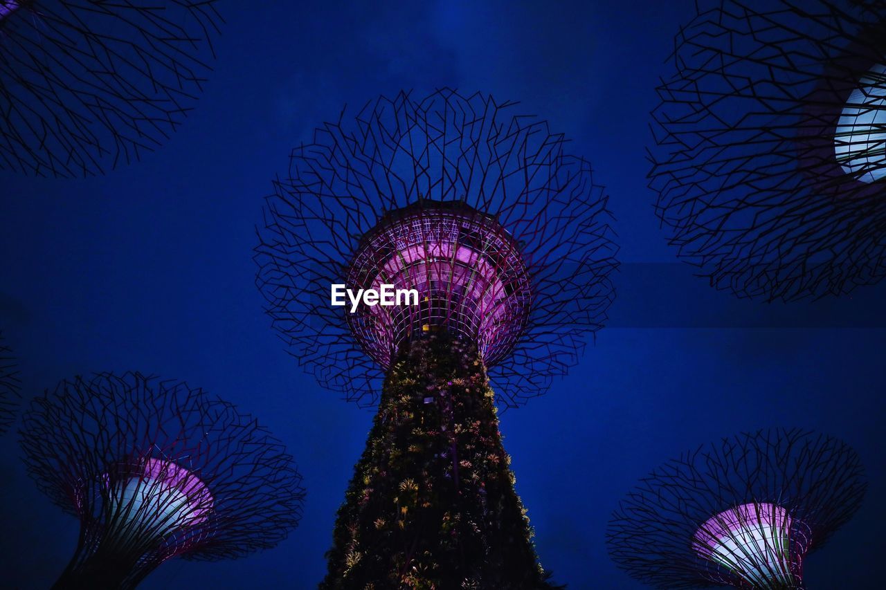 LOW ANGLE VIEW OF ILLUMINATED FERRIS WHEEL