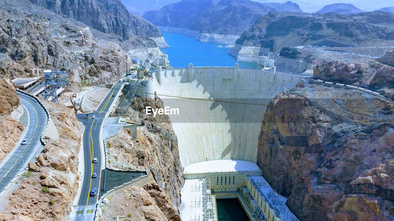 HIGH ANGLE VIEW OF DAM AND MOUNTAIN