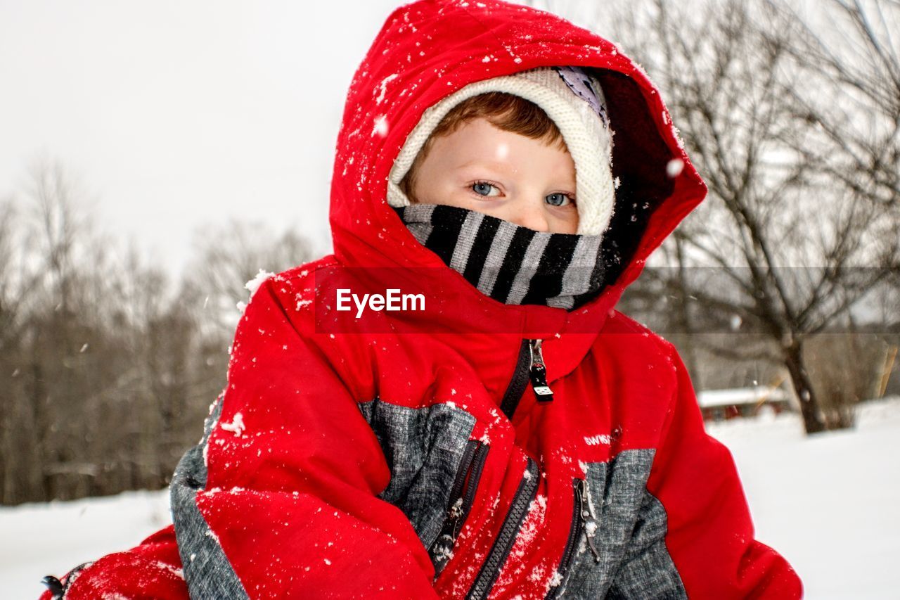 Portrait of boy in snow