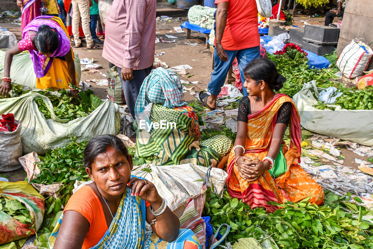 GROUP OF PEOPLE FOR SALE AT MARKET