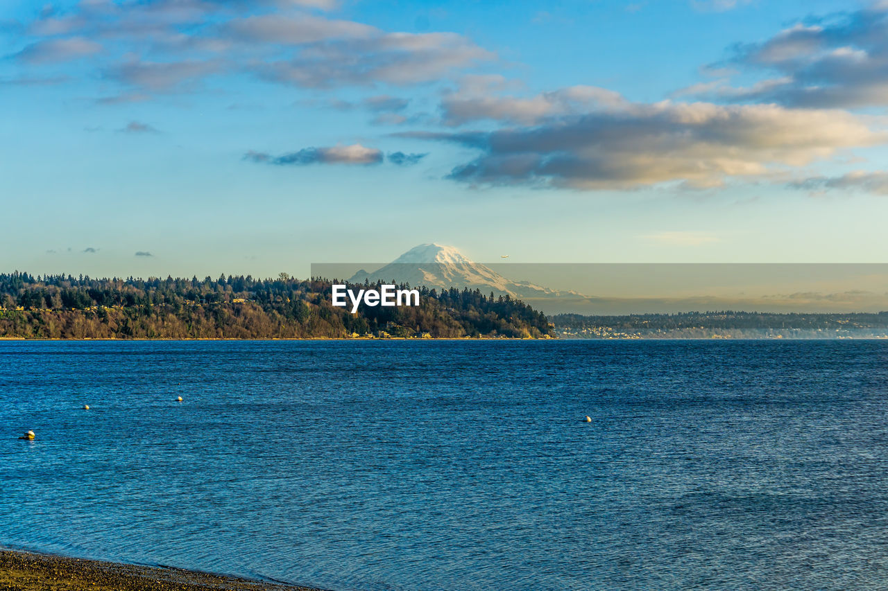 A view of mount rainier across the puget sound. photo taken in burien, washington.