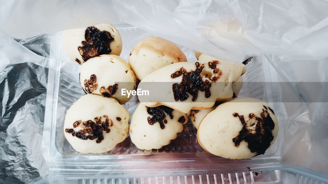 High angle view of kue cubit in box