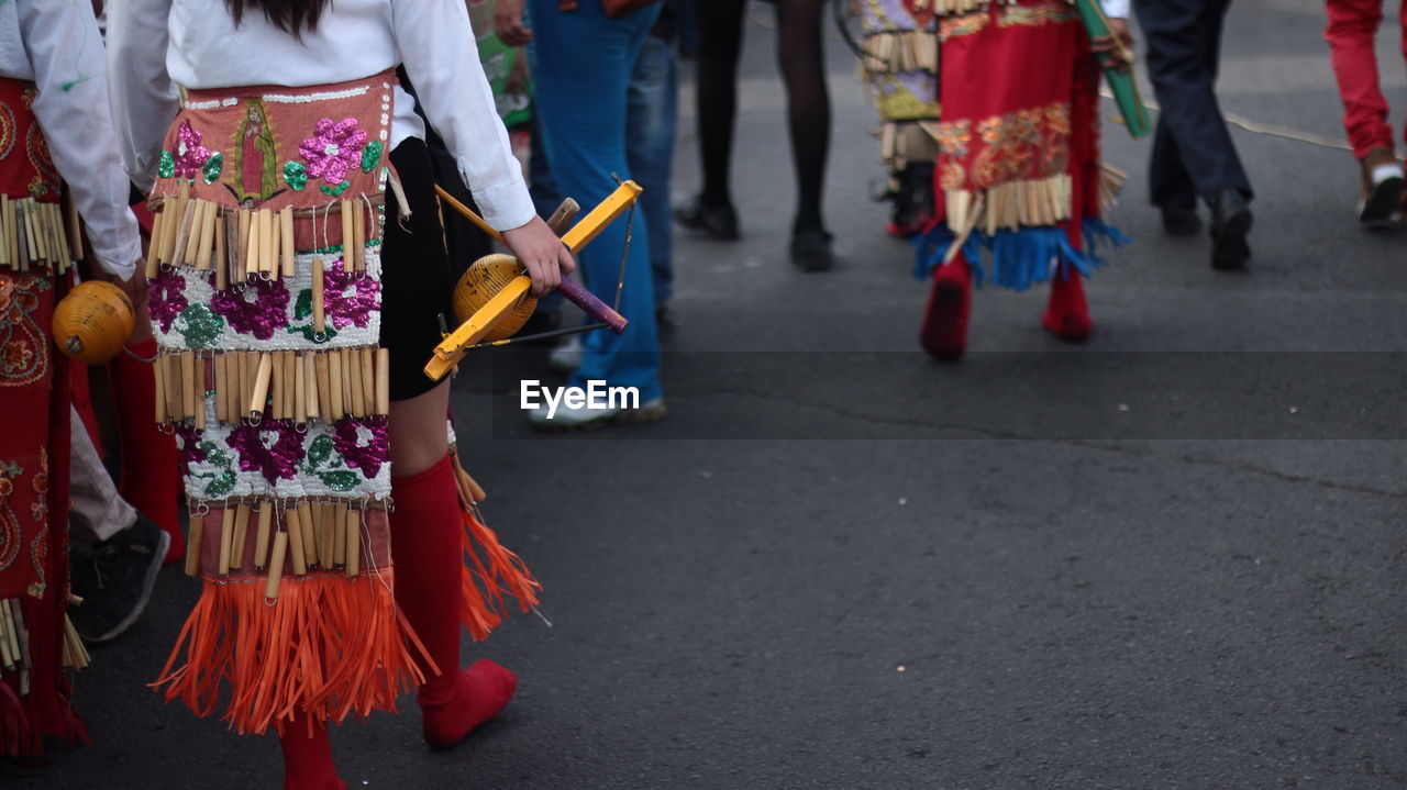 Low section of people on street during festival