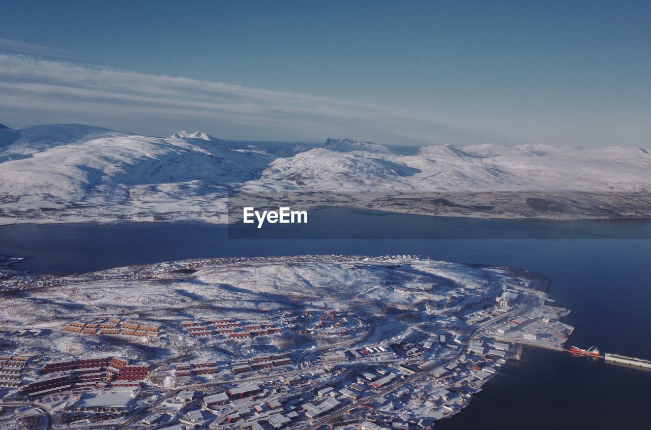 High angle view of snowcapped mountains against sky