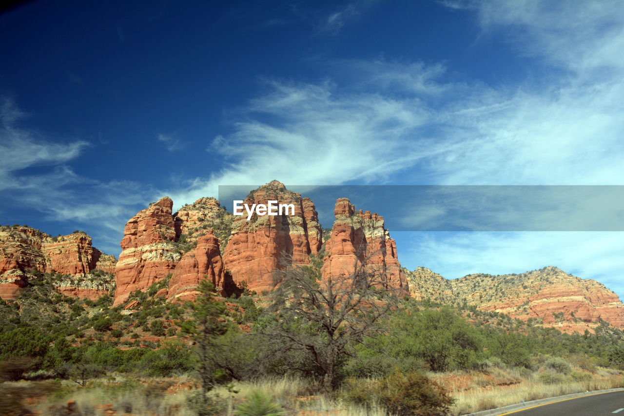 Low angle view of rock formation against blue sky