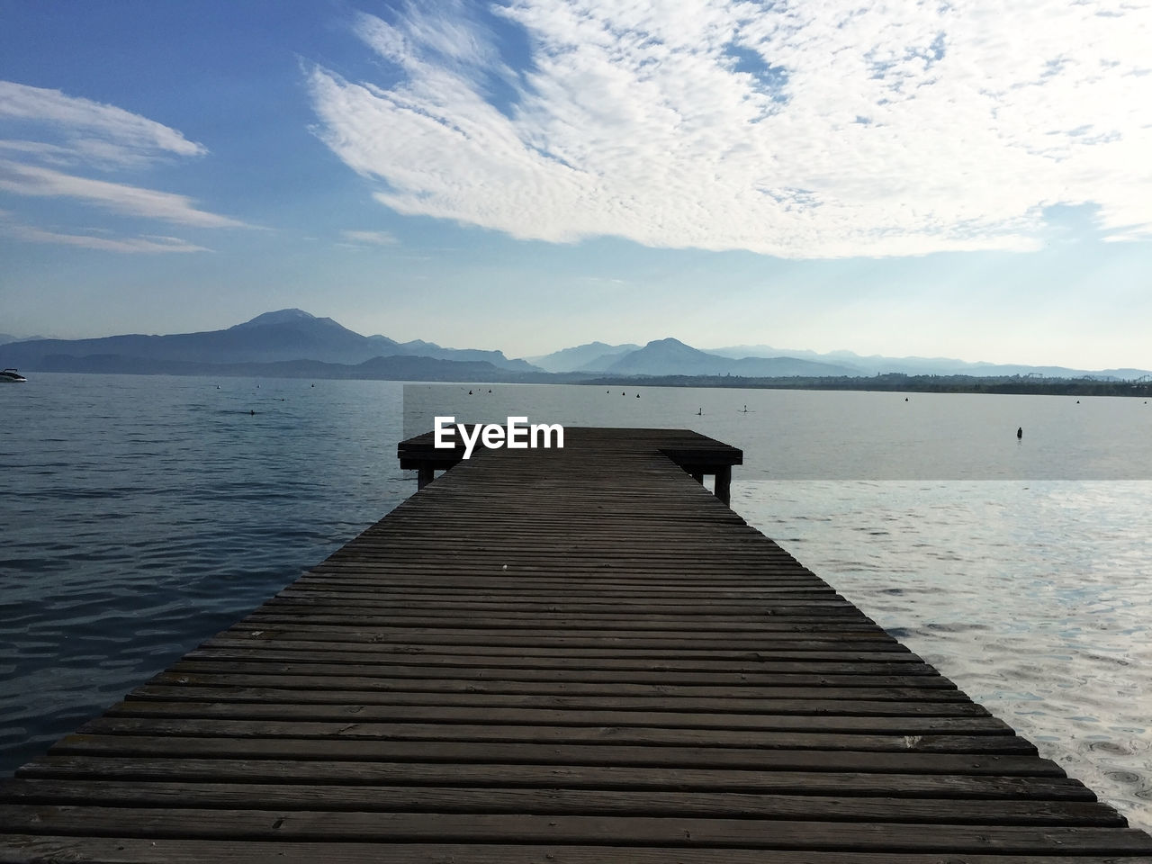 Pier over sea against sky